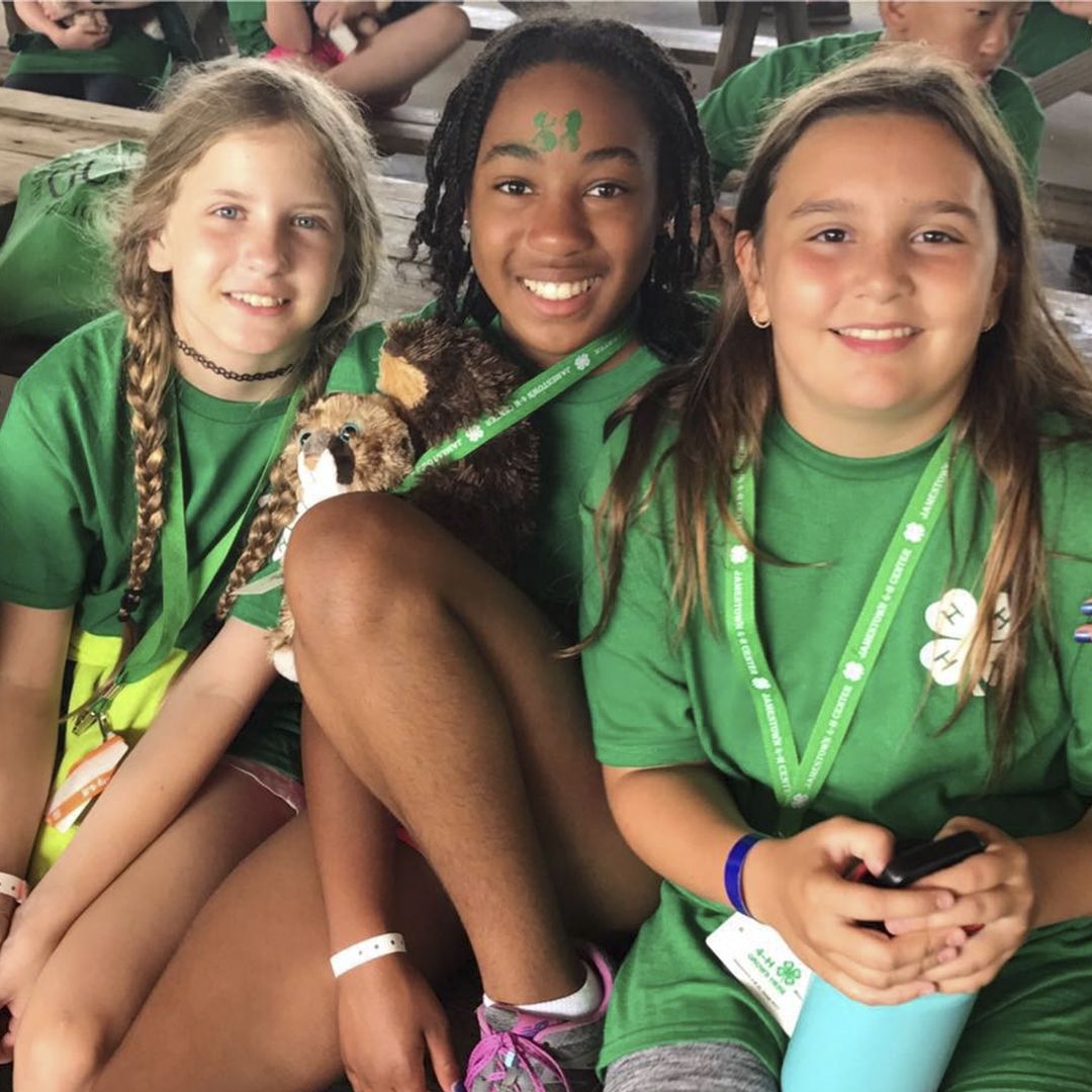 Three girl campers enjoy their time at Jamestown 4-H junior camp